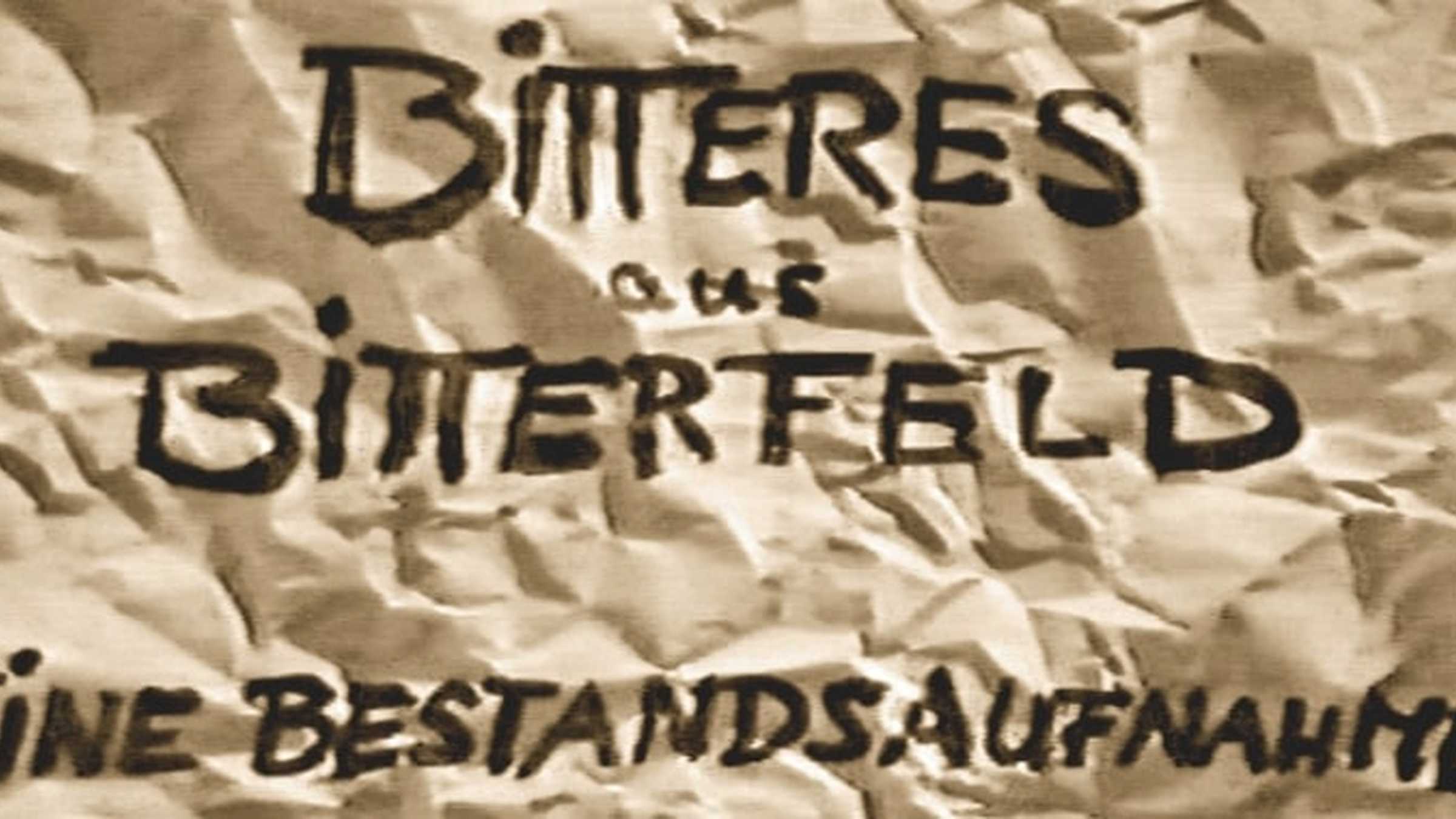 Aufblende des Films "Bitteres aus Bitterfeld" - Quelle Rainer Hällfritzsch Dieses Bild zeigt die Aufblende des Films "Bitteres aus Bitterfeld". Darauf steht "Bitteres aus Bitterfeld - Eine Bestandsaufnahme"