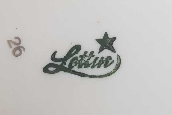 Firmenmarke Lettin mit geschwungenem Schriftzug und wqStern als i-Punkt